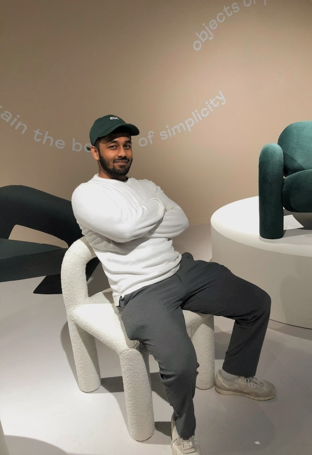 Ridwan sitting on a chair